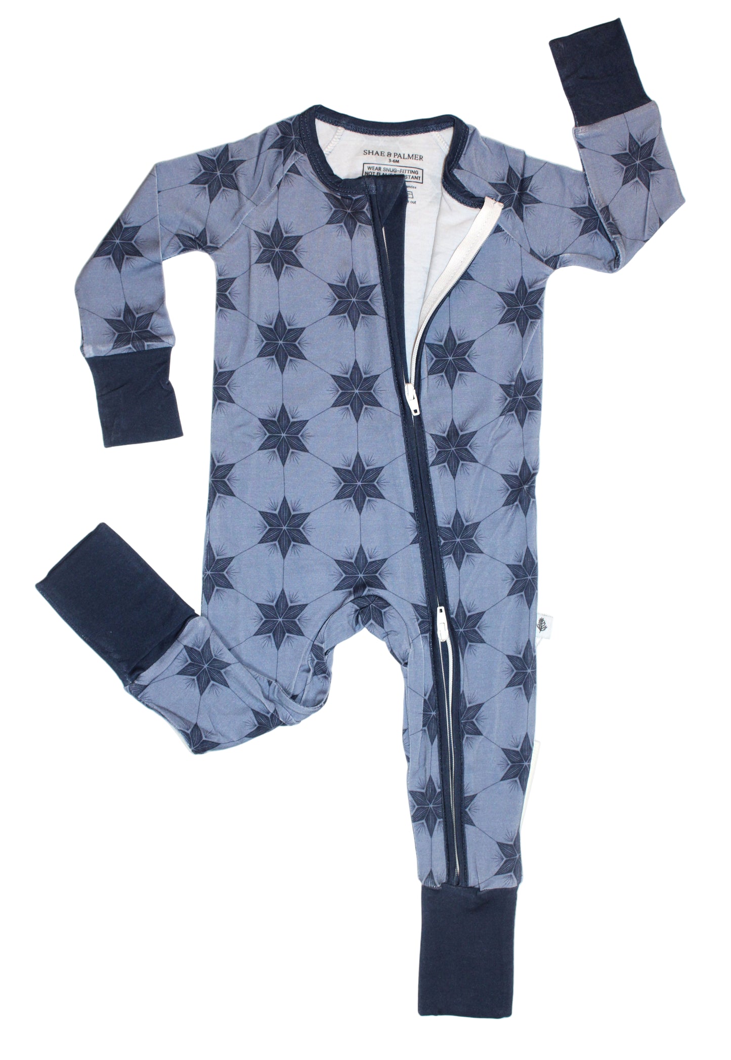 Winter blue bamboo baby pajamas by Shae & Palmer — cozy starry print sleepwear made for Christmas or Hanukkah, perfect holiday gift for little ones.