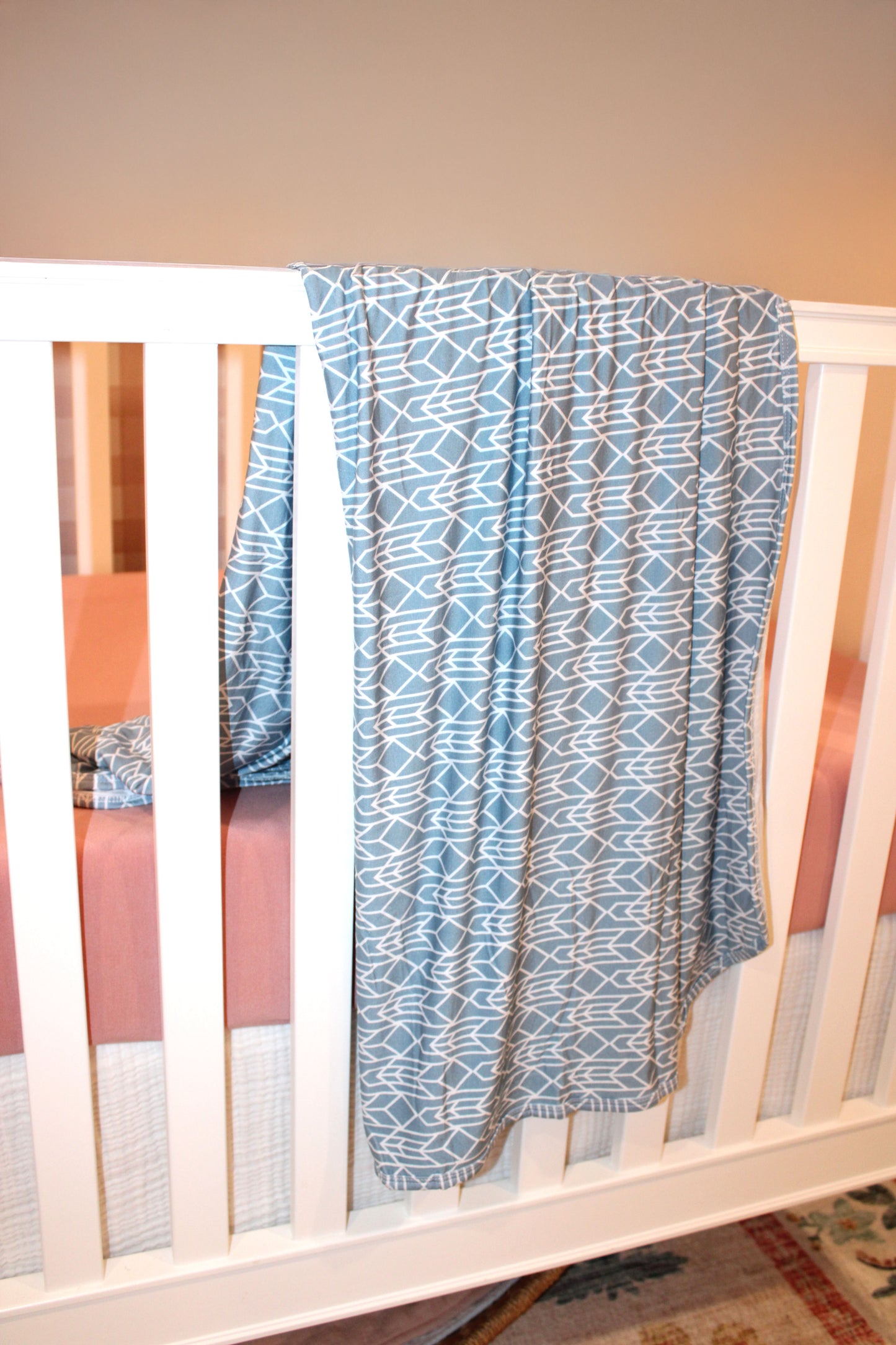 Stone Blue bamboo baby blanket from Shae & Palmer’s Runway Collection — lightweight, sustainable, and designed with a chic geometric pattern.