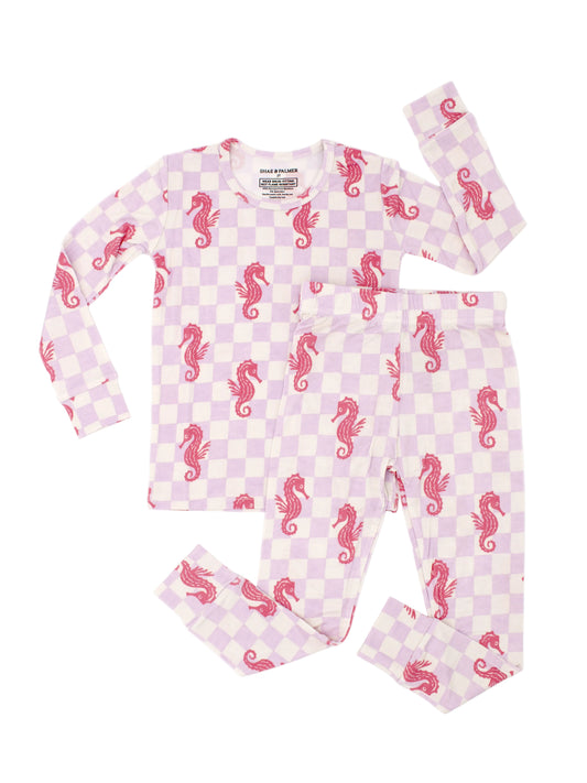 Seahorse Splash toddler bamboo pajamas by Shae & Palmer with coral pink seahorses on lavender checkerboard, ultra-soft breathable fabric