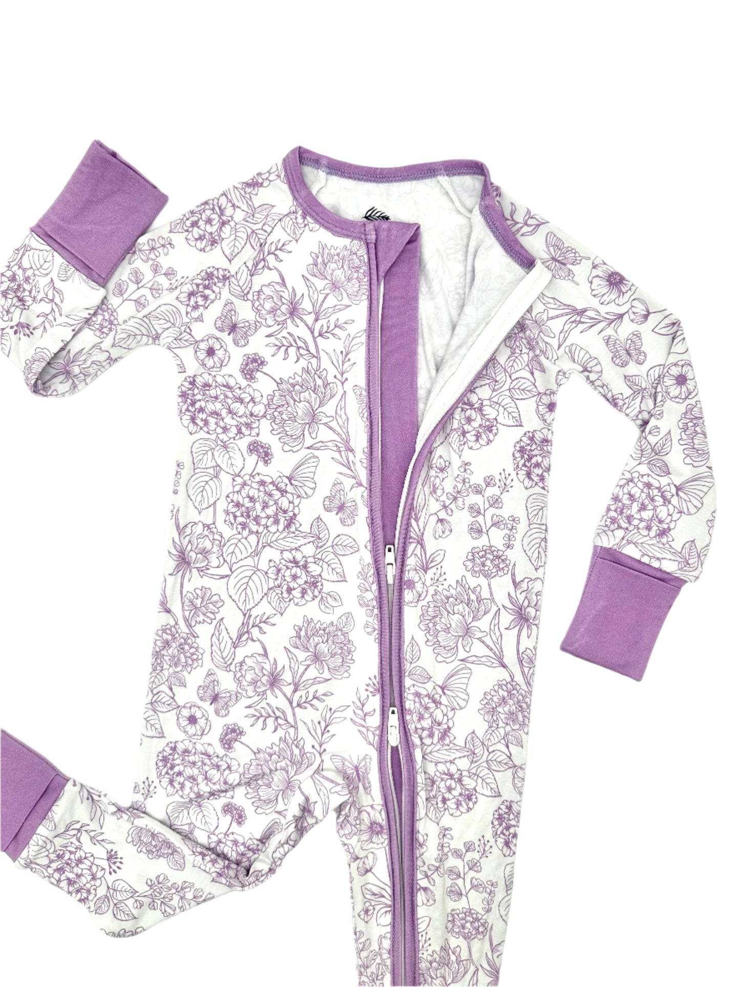 Shae & Palmer botanical bamboo baby romper in amethyst purple floral print, featuring a double zipper for easy diaper changes, buttery-soft breathable bamboo fabric, and sustainable eco-friendly materials designed for cozy sleep and all-day play.
