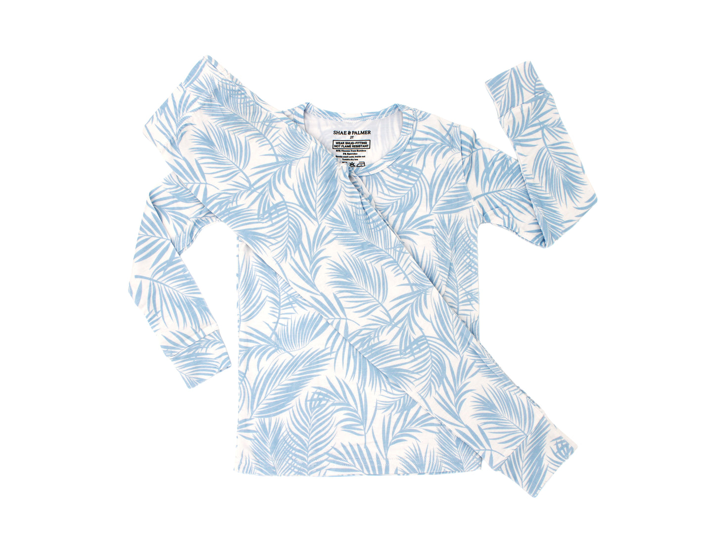 toddler wearing Cali Coastal Baby Blue bamboo pajamas by Shae & Palmer, soft breathable temperature-regulating fabric with palm print