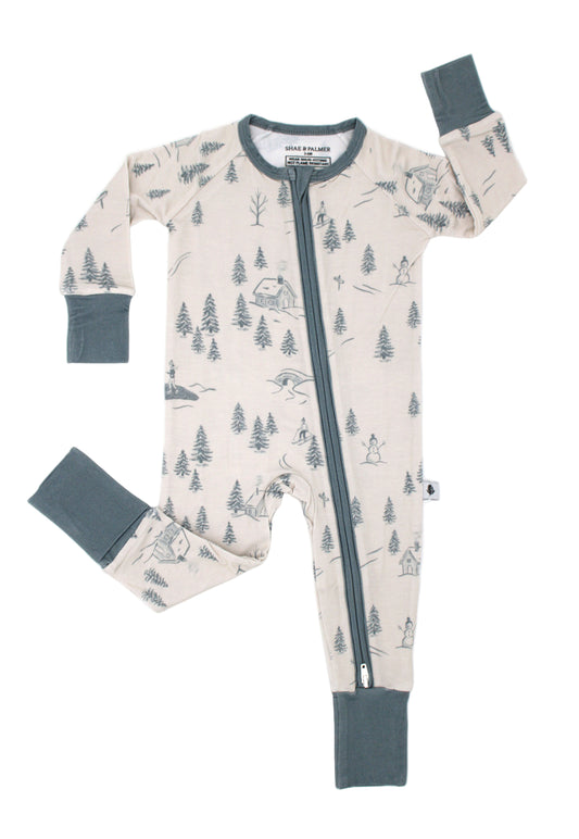 Baby wearing Shae & Palmer Winterdream Collection bamboo pajamas in Snow White — cozy holiday sleepwear perfect for Christmas mornings and winter nights.