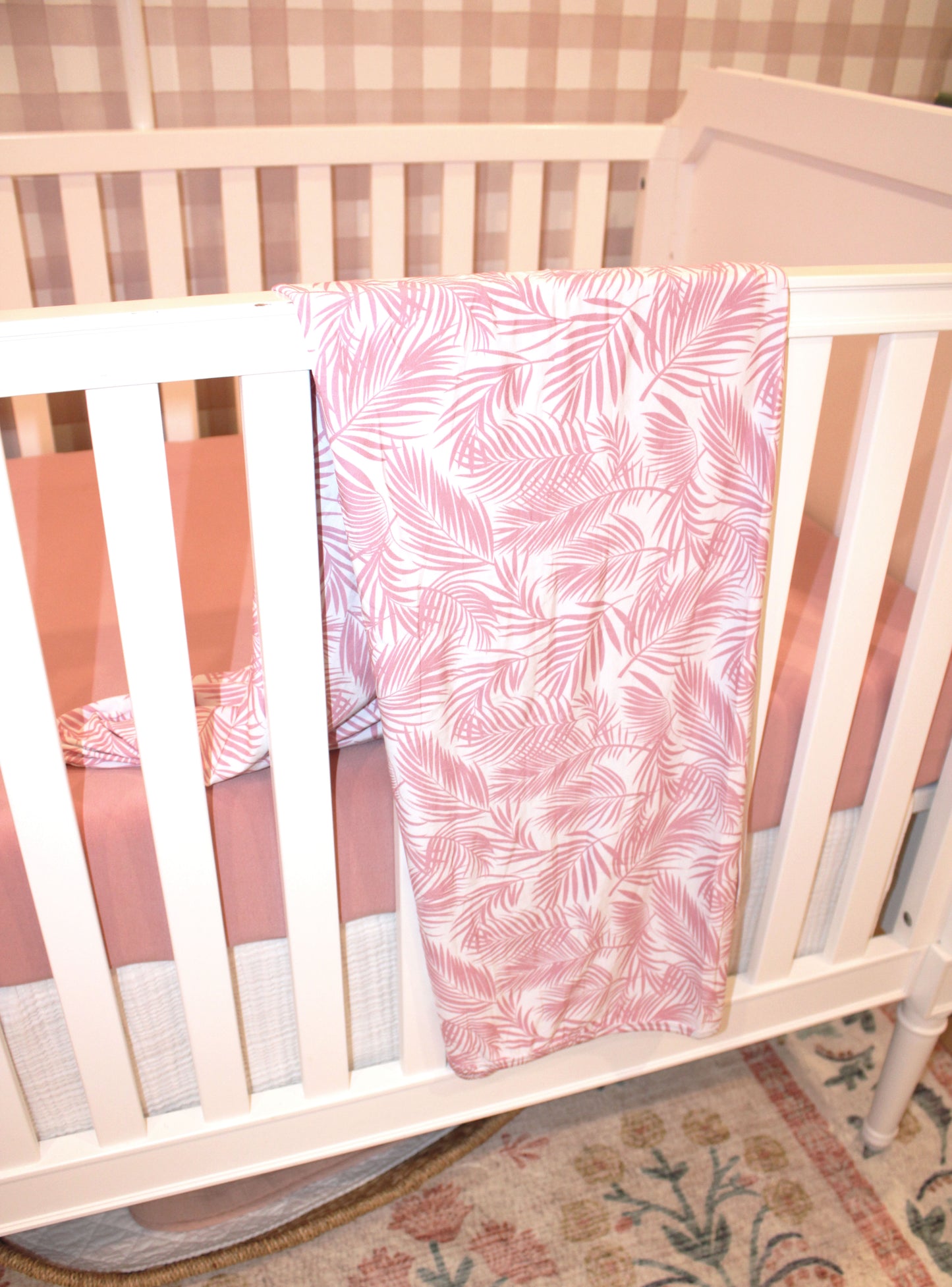 Soft bamboo baby blanket in Cali Coastal pink — lightweight, eco-friendly, and perfect for swaddling or gifting to new moms.