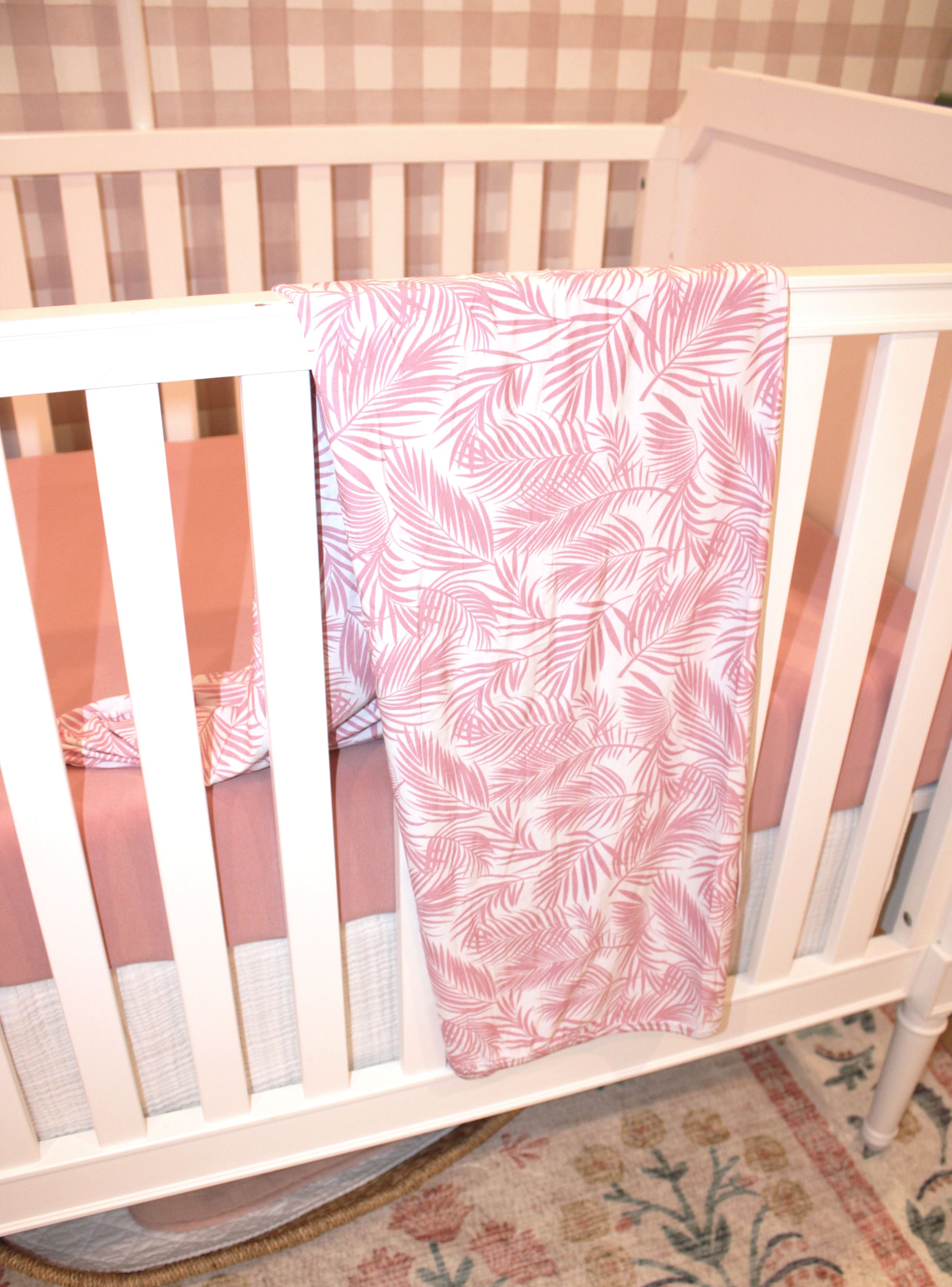 Soft bamboo baby blanket in Cali Coastal pink — lightweight, eco-friendly, and perfect for swaddling or gifting to new moms.
