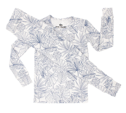 Transform your toddler’s bedtime with the luxuriously soft Tropical Bliss two-piece pajama set! Featuring a breezy palm leaf design, this set captures the essence of tropical escapes with its playful and vibrant vibe, adding a fresh twist to your little one’s nightly routine. Crafted from eco-friendly bamboo fabric, the Tropical Bliss set is ultra-soft, breathable, and gentle on sensitive skin. Bamboo’s natural temperature-regulating and moisture-absorbing properties help keep your toddler cool in warmer we