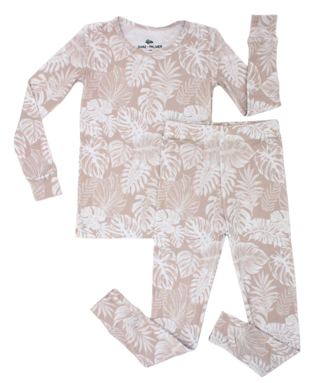 Transform your toddler’s bedtime with the luxuriously soft Tropical Bliss two-piece pajama set! Featuring a breezy palm leaf design, this set captures the essence of tropical escapes with its playful and vibrant vibe, adding a fresh twist to your little one’s nightly routine. Crafted from eco-friendly bamboo fabric, the Tropical Bliss set is ultra-soft, breathable, and gentle on sensitive skin. Bamboo’s natural temperature-regulating and moisture-absorbing properties help keep your toddler cool in warmer we