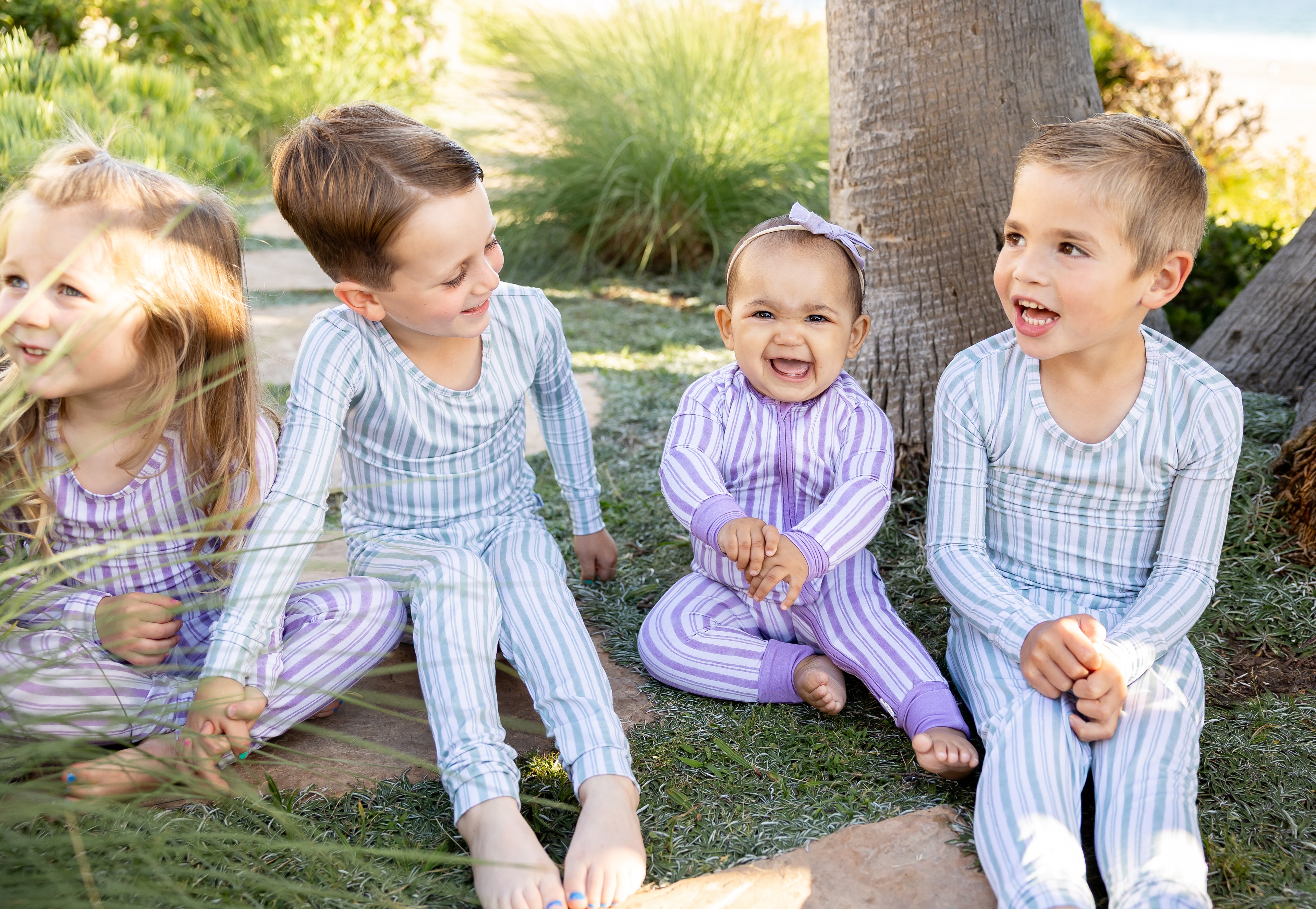 Baby wearing Studio Stripe Purple Haze bamboo pajamas by Shae & Palmer, soft breathable temperature-regulating fabric with lavender stripe print