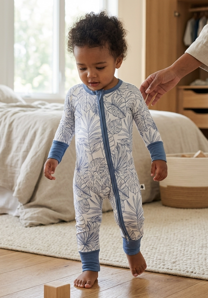Baby wearing Tropical Bliss bamboo pajamas by Shae & Palmer, soft breathable temperature-regulating fabric with palm leaf print