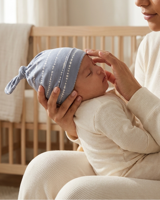 Blue Raspberry bamboo baby hat paired with matching baby pajamas
