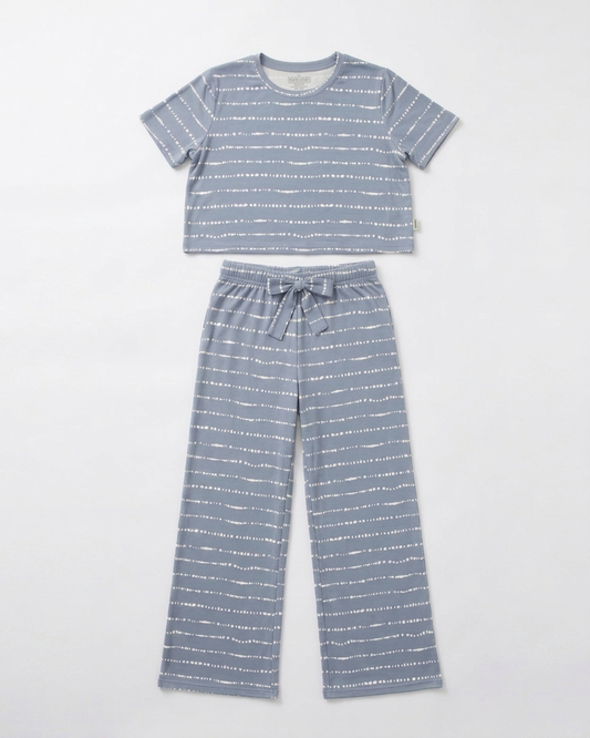 Women's Blue Raspberry Stripe bamboo pajama set displayed in a flat lay with a relaxed-fit top and pants in soft hand-painted blue stripes from the Market Fresh Collection by Shae & Palmer.