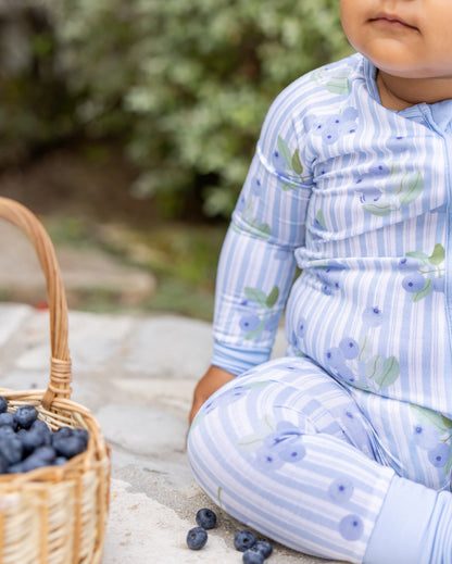 Close-up of Blueberry Lane blue striped bamboo pajamas on a baby, showing soft, breathable fabric gentle on sensitive skin