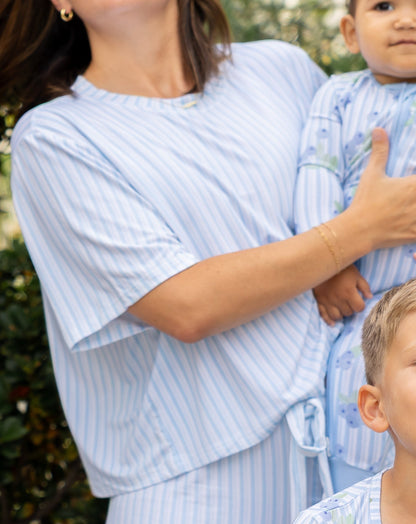 Mom, baby, and kid boy in matching Blueberry Lane blue striped bamboo pajamas from Shae & Palmer's mommy-and-me Market Fresh collection