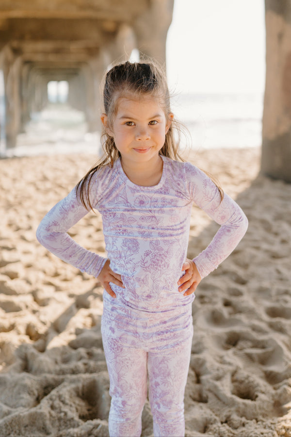 Sustainable and stylish Botanical Amethyst bamboo kids pajamas from Shae & Palmer, featuring a double-zip romper design, ultra-soft eco-friendly bamboo fabric, and a modern floral print inspired by interior design aesthetics.