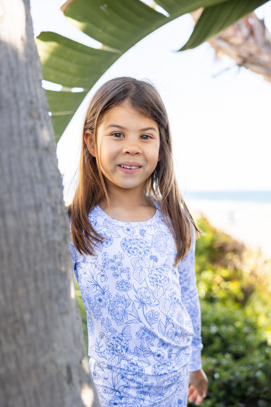 Big kid wearing Shae & Palmer Botanical Blue bamboo pajamas featuring a refined blue floral print with ultra-soft breathable bamboo fabric for cozy sleep and all-day comfort.