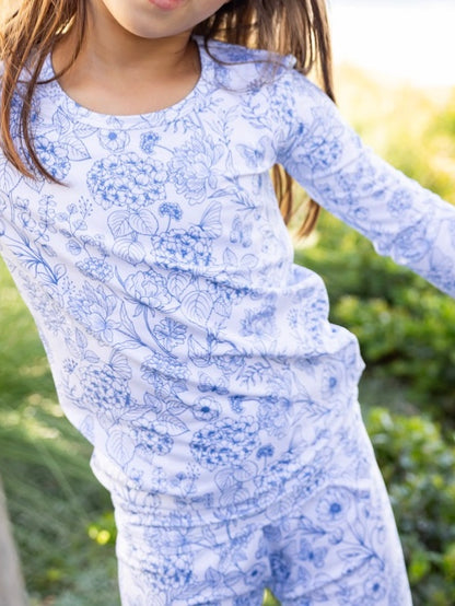 Toddler wearing Shae & Palmer Botanical Blue bamboo pajamas featuring an elegant blue floral print and ultra-soft breathable bamboo fabric for sleep and play.