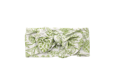 Close-up of Botanical Moss Green bamboo headband floral print by Shae & Palmer, soft green tones