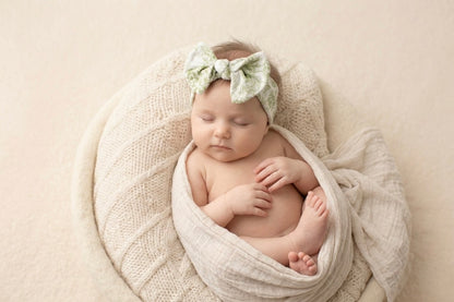 Soft stretchy fit of Botanical Moss Green bamboo baby headband by Shae & Palmer, gentle and comfortable on skin