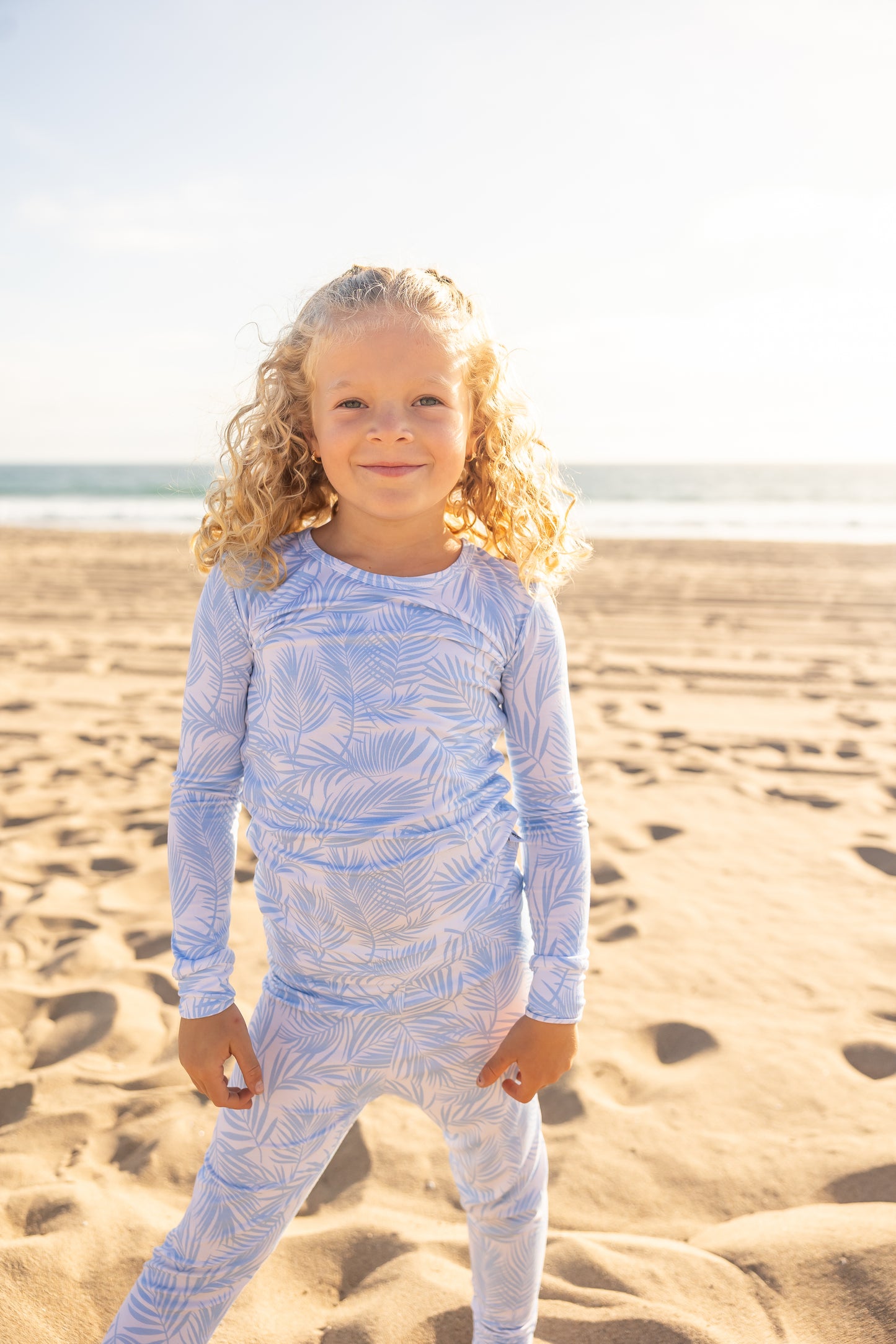 Big kids bamboo pajamas in the Cali Coastal Baby Blue print featuring soft coastal palm leaves by Shae & Palmer