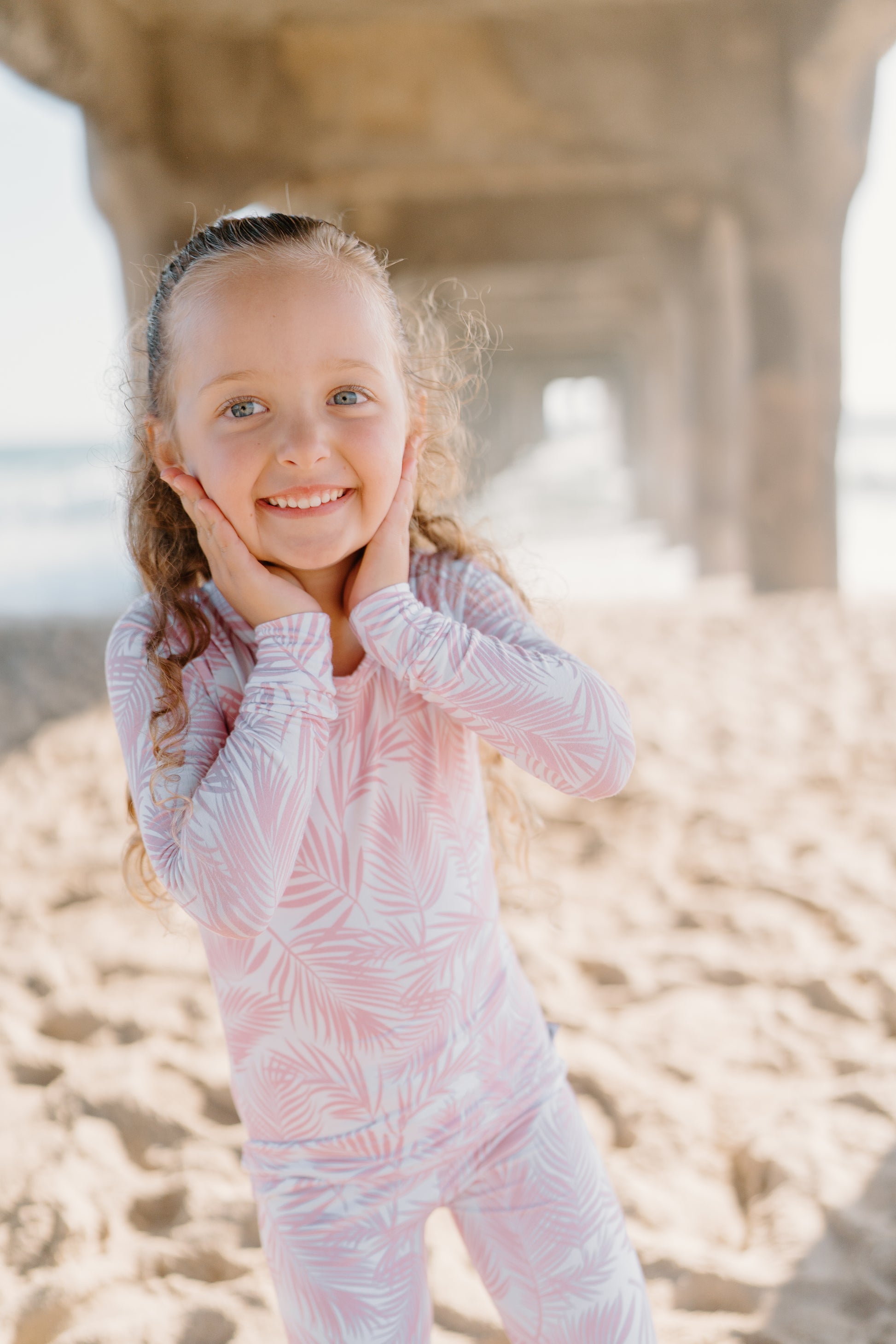 Transform your toddler’s bedtime with the luxuriously soft Cali Coastal two-piece pajama set! Featuring a breezy palm leaf design inspired by the serenity of coastal living, this vibrant print blends playfulness and style, perfect for adding a refreshing touch to your little one’s nightly routine. Crafted from eco-friendly bamboo fabric, the Cali Coastal set is incredibly soft, breathable, and gentle on sensitive skin. Bamboo’s natural temperature-regulating and moisture-absorbing properties.