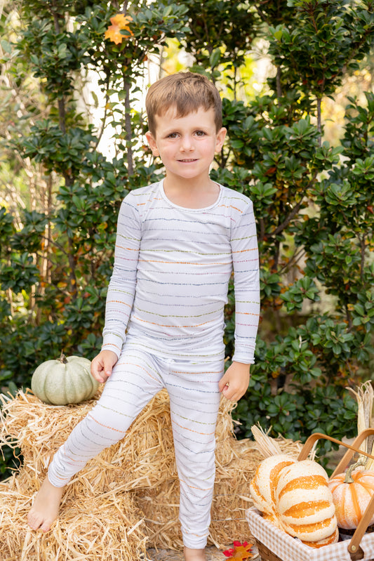Confetti Stripe bamboo pajamas featuring colorful hand-painted stripes in soft, playful hues.