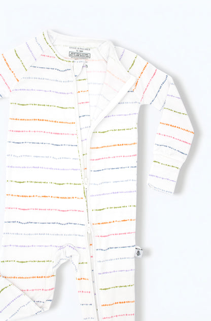 Confetti Stripe colorful bamboo baby pajama romper styled in a flat lay