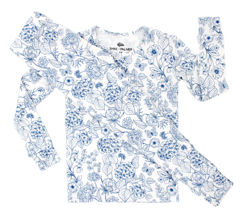 Luxury baby and toddler romper in Botanical Blue by Shae & Palmer, designed with eco-conscious bamboo material, a gorgeous floral print, and premium details for parents who value comfort, style, and sustainability in children’s clothing.