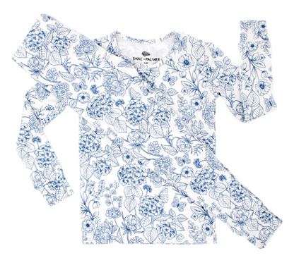 Luxury baby and toddler romper in Botanical Blue by Shae & Palmer, designed with eco-conscious bamboo material, a gorgeous floral print, and premium details for parents who value comfort, style, and sustainability in children’s clothing.