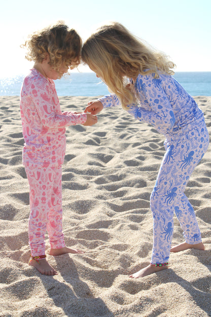 Close-up of Mermaid Cove toddler two-piece bamboo pajamas featuring mermaids, starfish, and ocean details.