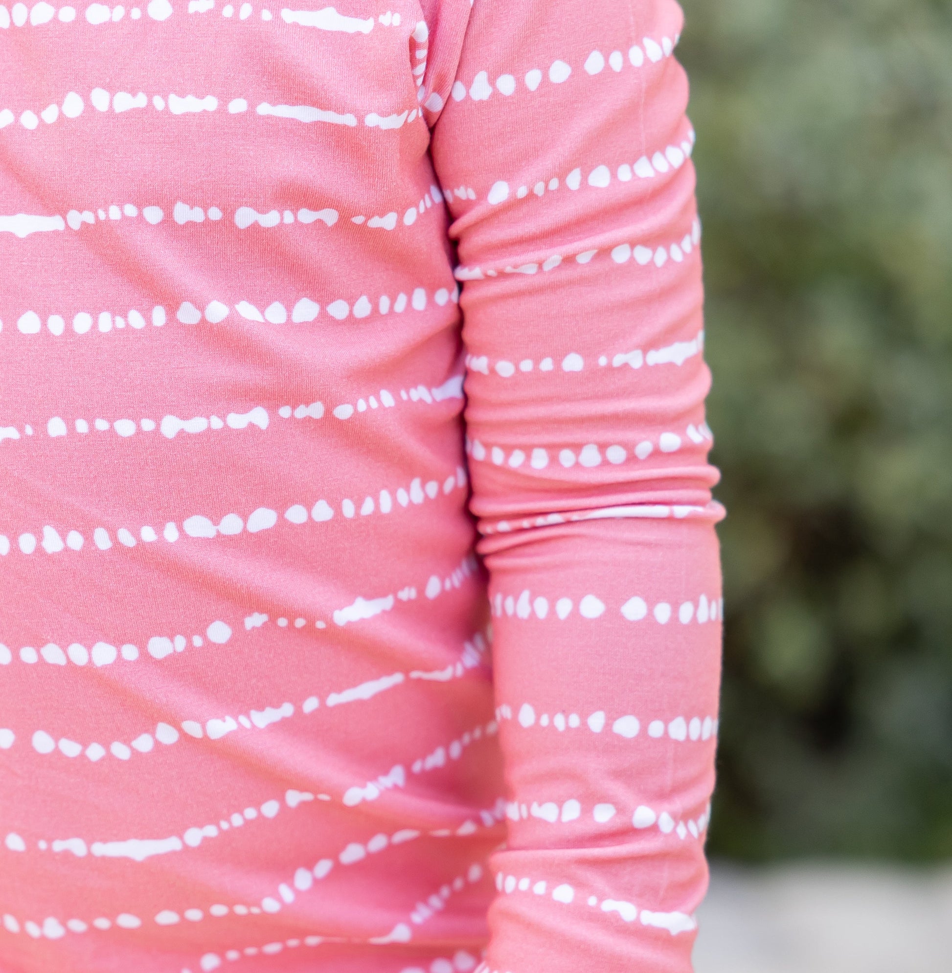 Close-up of Watermelon Blush Stripe print on soft, breathable bamboo pajama fabric