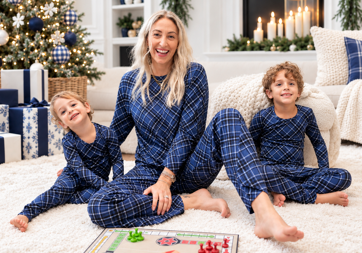 Mom matching with toddler and big kid in Midnight Plaid navy blue bamboo pajamas for Christmas and Hanukkah family photos