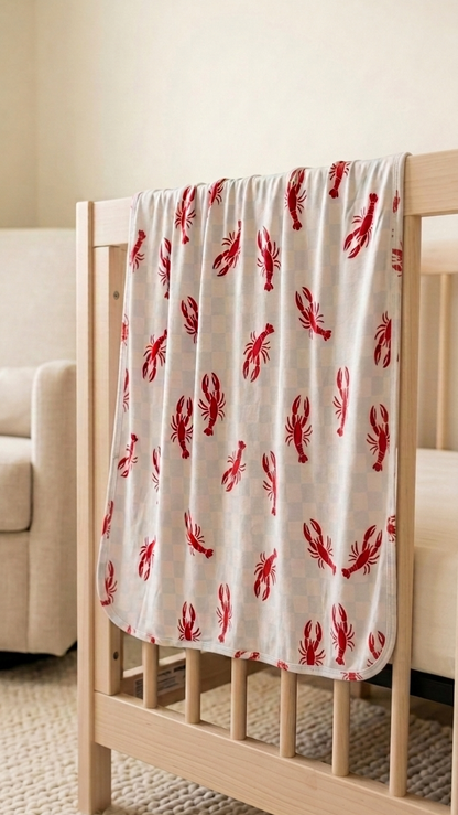 Ultra-soft bamboo baby blanket in Lobster Splash print highlighting breathable and gentle fabric texture