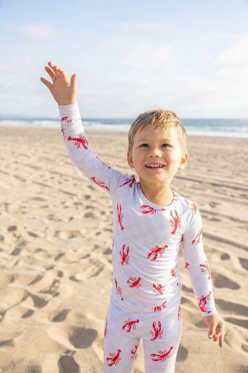 Bamboo toddler pajamas in Lobster Splash print. Soft, breathable, stretchy two-piece set with temperature-regulating fabric for comfortable sleep and play.