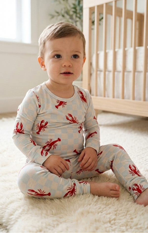 Two-piece toddler pajama set in Lobster Splash print with long sleeve top and fitted pants in soft bamboo fabric