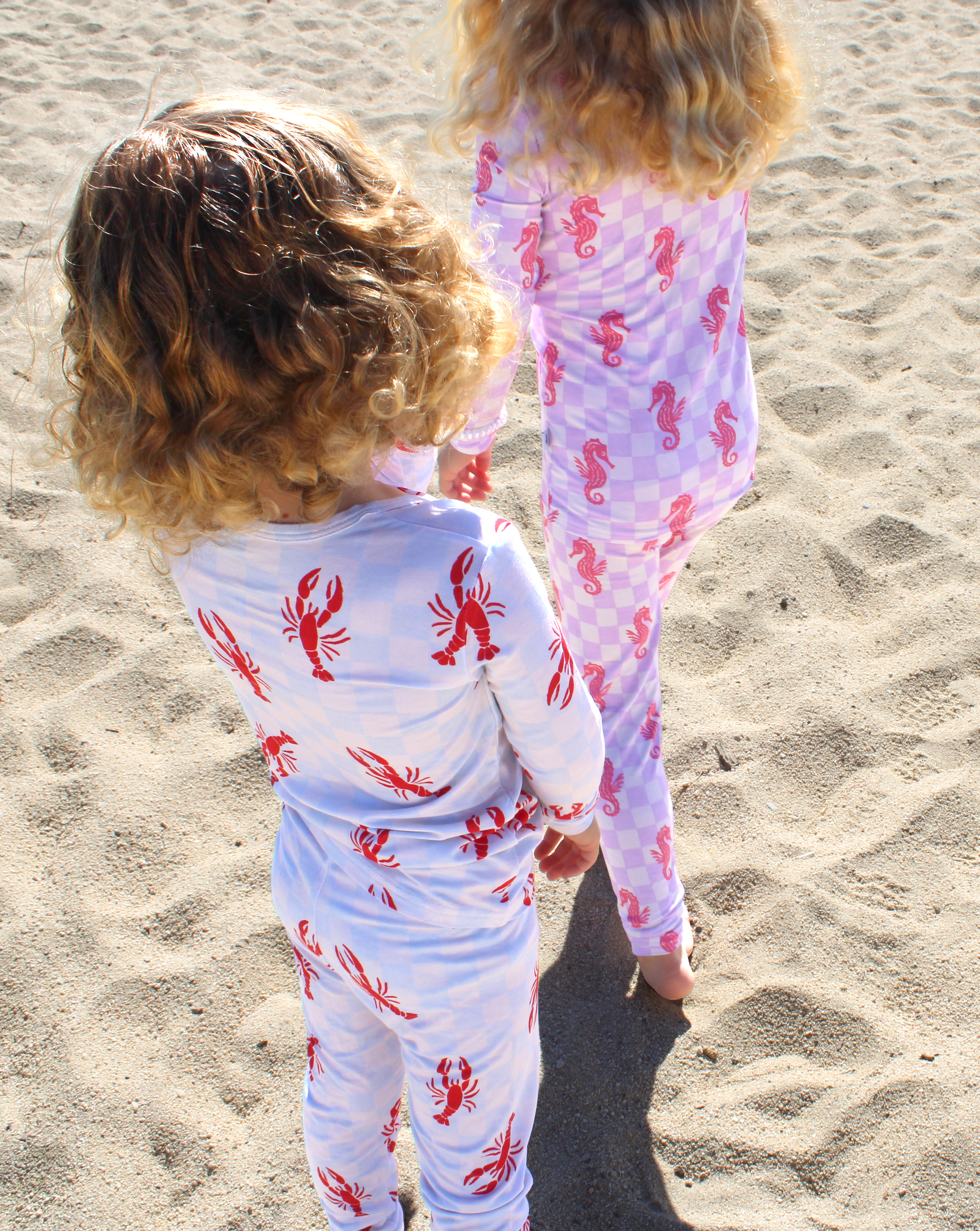Two-piece toddler pajama set in Lobster Splash print with long sleeve top and fitted pants in soft bamboo fabric