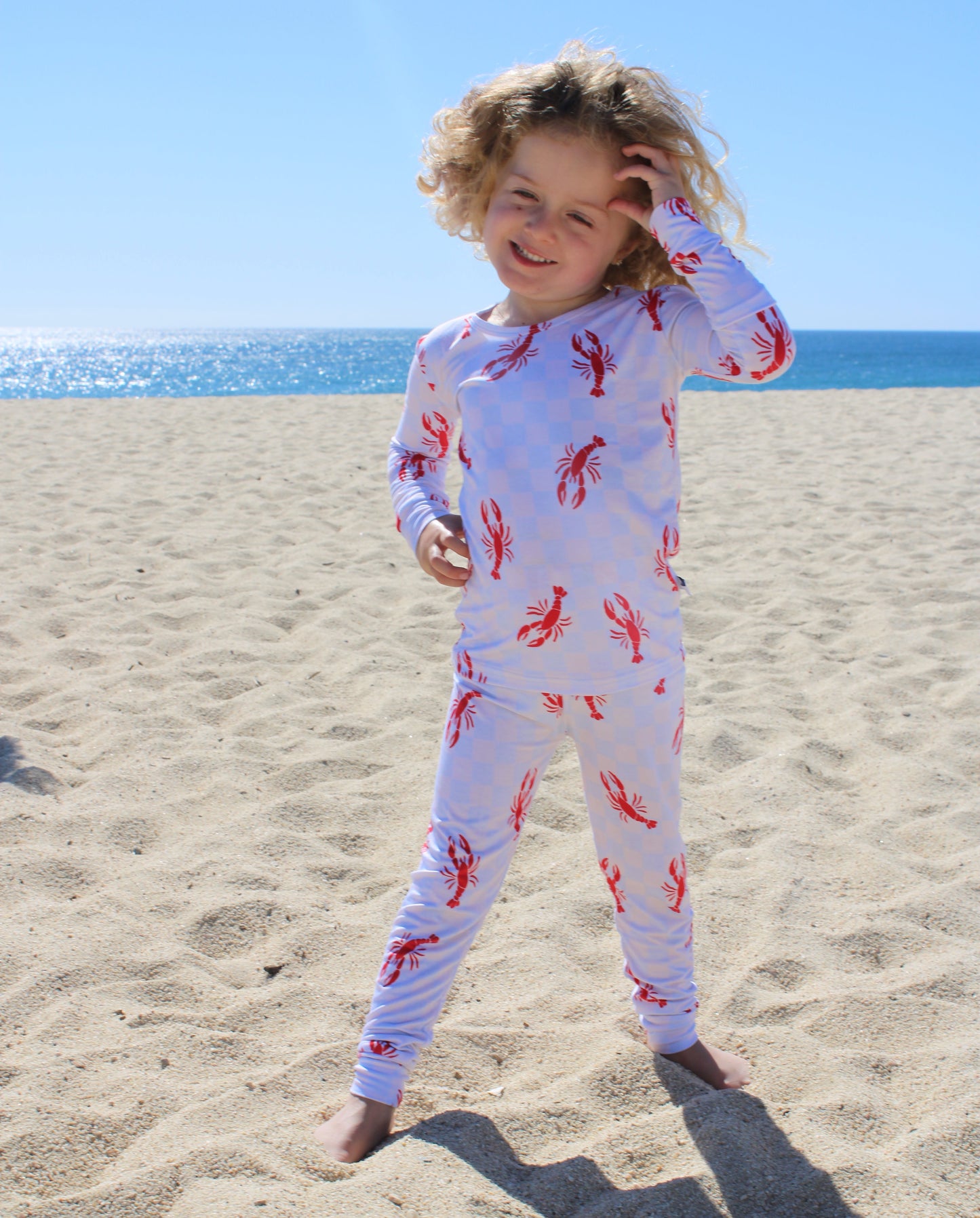 Soft bamboo toddler pajamas in Lobster Splash print highlighting breathable and stretchy fabric texture