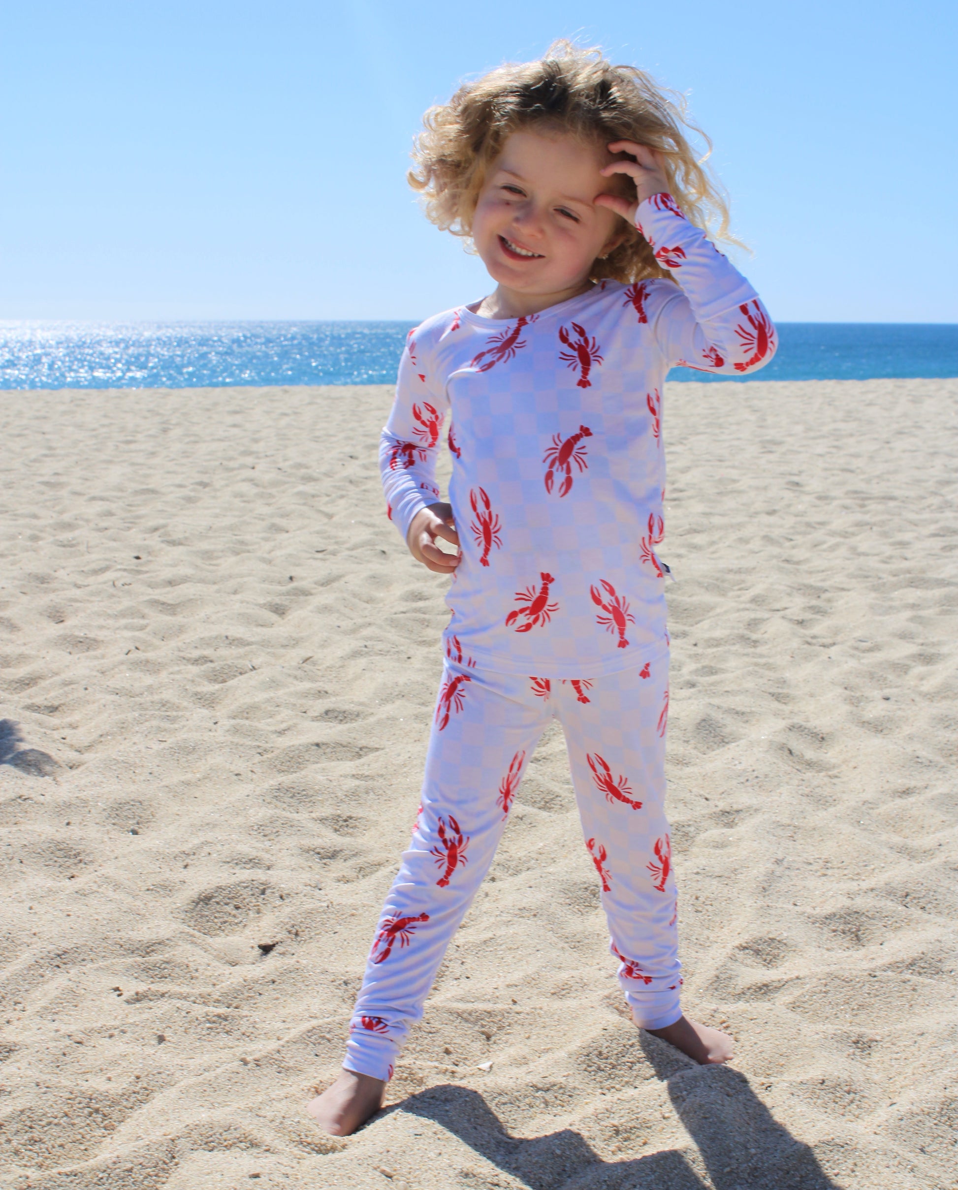 Soft bamboo toddler pajamas in Lobster Splash print highlighting breathable and stretchy fabric texture
