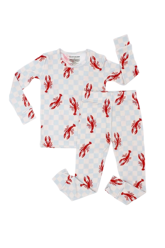 Toddler wearing Lobster Splash bamboo pajamas with blue checkered print and red lobster pattern front view