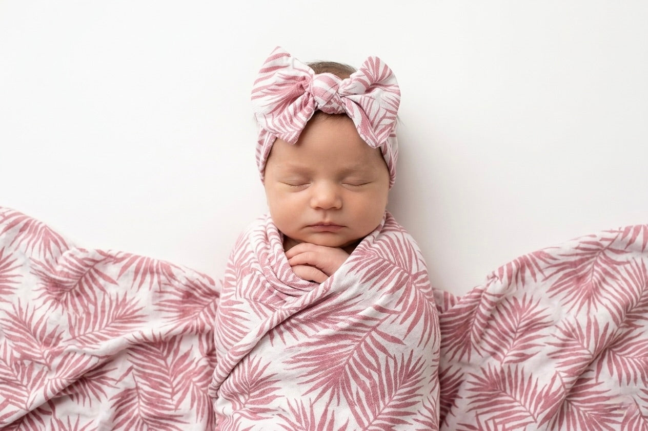 Luxury bamboo baby headband by Shae & Palmer in the Cali Coastal Pink palm leaf print.