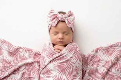 Luxury bamboo baby headband by Shae & Palmer in the Cali Coastal Pink palm leaf print.