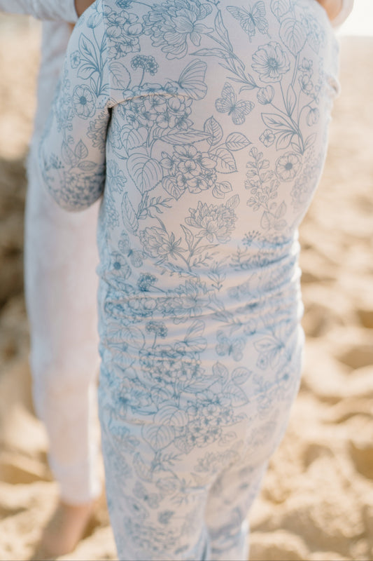 This luxury Botanical Blue bamboo romper for kids by Shae & Palmer offers breathable eco-conscious fabric, a delicate floral design, and a practical double-zip closure, making it ideal for stylish, comfortable baby and toddler sleepwear.