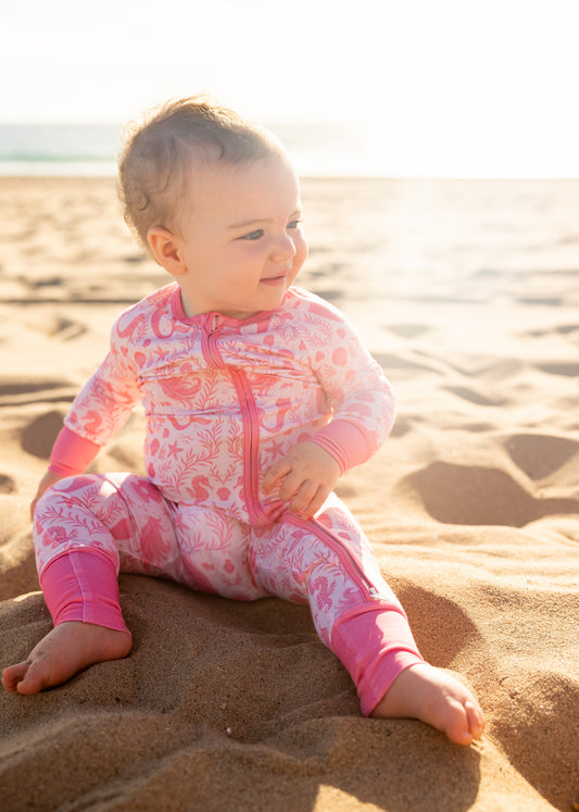Close-up of Shae & Palmer Mermaid Cove bamboo baby romper with whimsical mermaids, seashells, and buttery-soft bamboo fabric detail