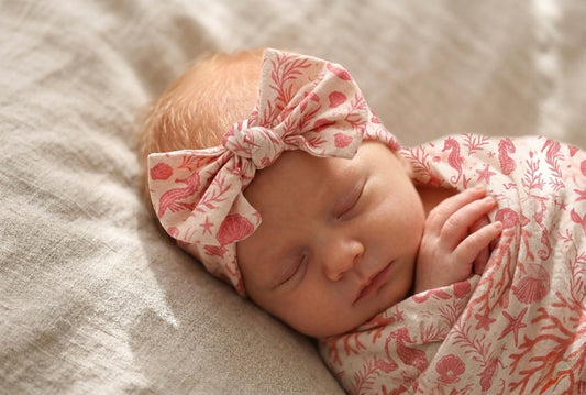 Mermaid Cove bamboo baby headband by Shae & Palmer with mermaid and seashell print, soft stretchy fabric