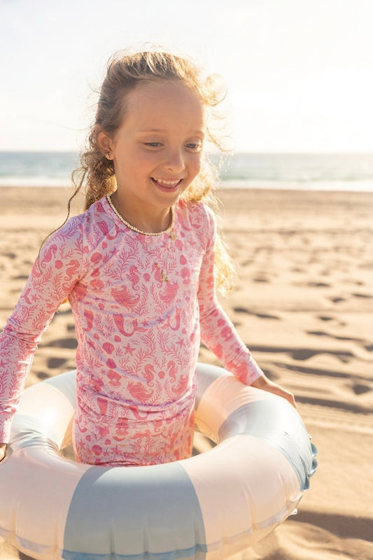 Big kids bamboo pajamas in the Mermaid Cove print featuring soft pink mermaids, seashells, and coastal-inspired details by Shae & Palmer