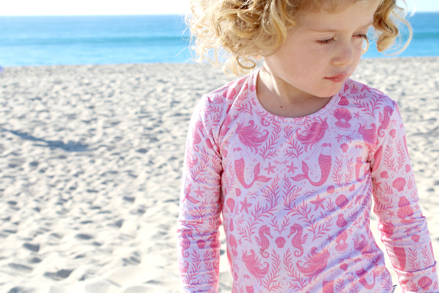 Luxury toddler bamboo sleepwear in Mermaid Cove print, breathable and temperature-regulating fabric.