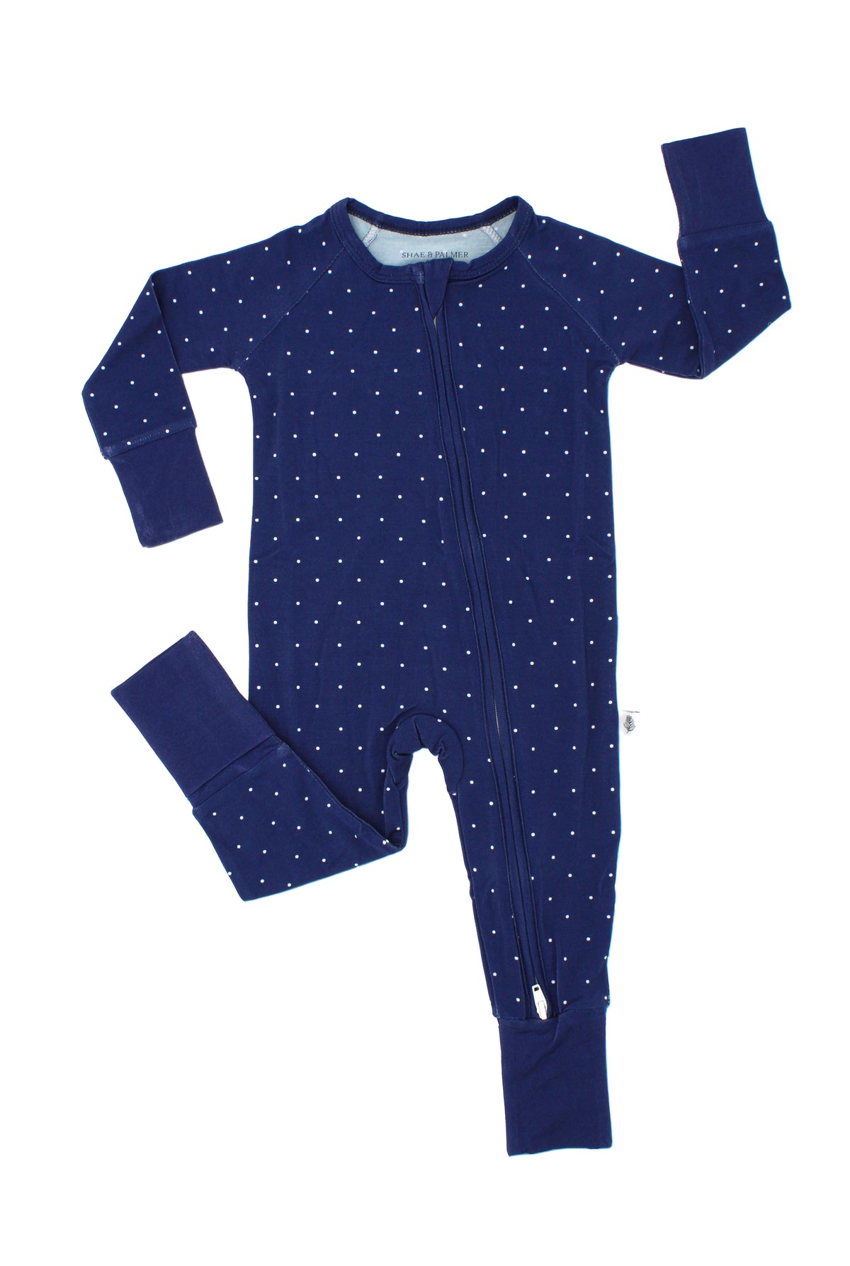 Midnight Dot Collection bamboo baby romper by Shae & Palmer featuring a classic navy dot print on buttery-soft, breathable bamboo fabric. Festive Hanukkah and Christmas baby pajamas, perfect for coordinating matching family pajama sets, holiday family photos, Christmas morning, and cozy winter nights.