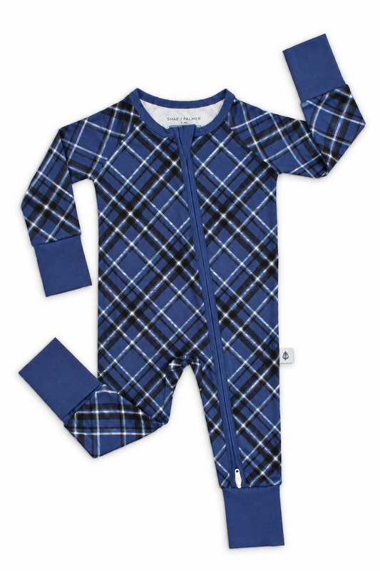 Midnight Plaid navy blue bamboo baby romper flat lay with double zipper and fold-over footies for holiday sleepwear