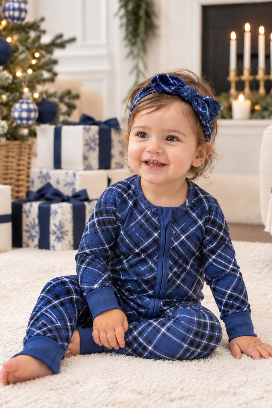 Baby wearing Midnight Plaid bamboo romper in navy blue, perfect for Hanukkah, Christmas and matching family holiday pajamas