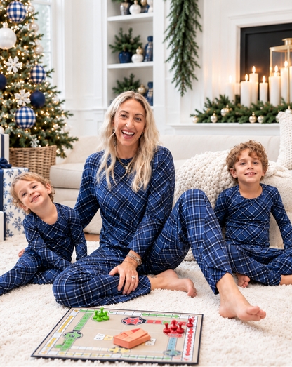 Family wearing matching Midnight Plaid navy blue bamboo pajamas for Hanukkah, Christmas, holiday photos, and cozy winter mornings