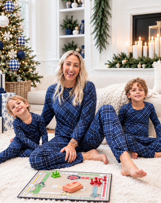 Family wearing matching Midnight Plaid navy blue bamboo pajamas for Hanukkah, Christmas, holiday photos, and cozy winter mornings