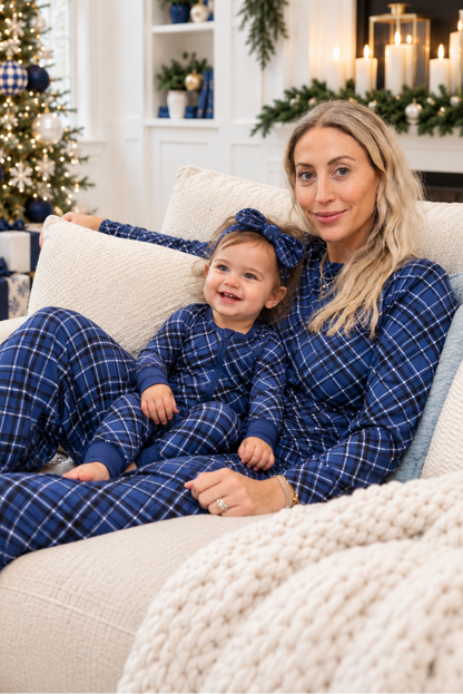 Mom and baby wearing matching Midnight Plaid bamboo pajamas in navy blue for Hanukkah and Christmas family celebrations